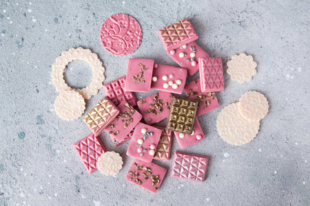 Ruby and white chocolate bar with chocolate truffle candies with gold, silver and crisp
