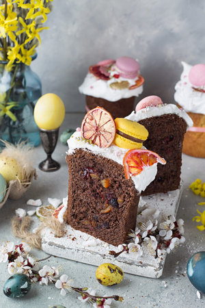 Easter table decoration with chocolate easter cake with colorful eggs