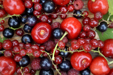 Fresh organic summer berries background. Cherry, currant, raspberryの写真素材