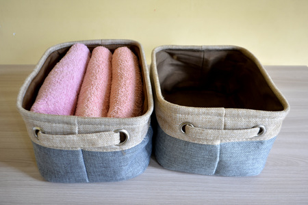 towels in textile basketの写真素材