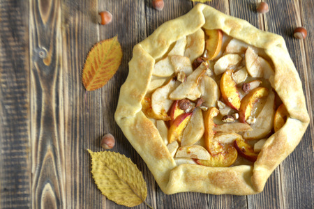 Peaches and nuts on wooden background Copy spaceの写真素材