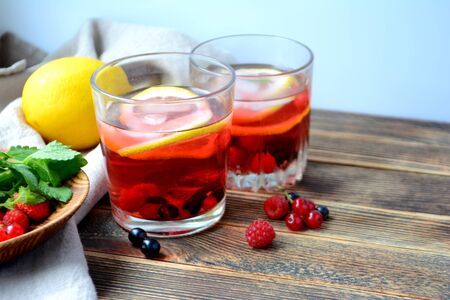 Cold berry lemonade in glasses Summer refreshing drinkの写真素材