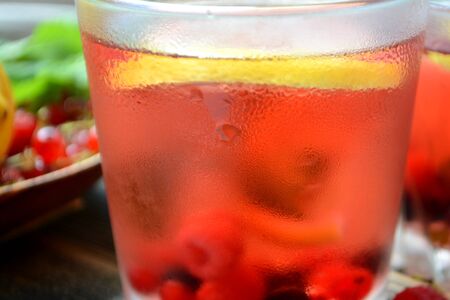 Cold berry lemonade in glasses Summer refreshing drink Close upの写真素材
