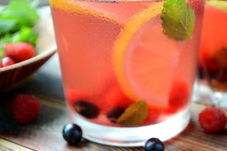 Cold berry lemonade in glasses Summer refreshing drink Close upの写真素材