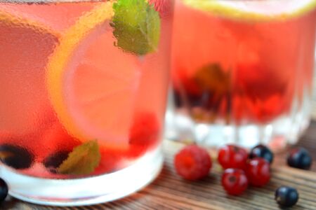 Cold berry lemonade in glasses Summer refreshing drink Close upの写真素材