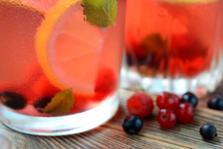Cold berry lemonade in glasses Summer refreshing drink Close upの写真素材