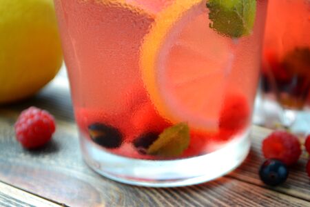 Cold berry lemonade in glasses Summer refreshing drink Close upの写真素材