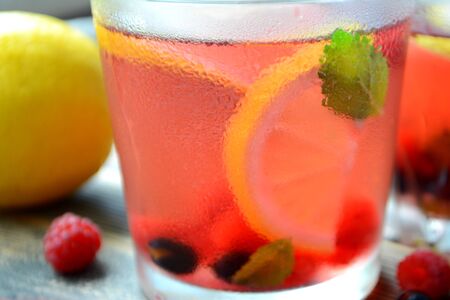 Cold berry lemonade in glasses Summer refreshing drink Close upの写真素材