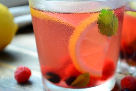 Cold berry lemonade in glasses Summer refreshing drink Close upの写真素材
