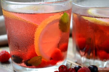 Cold berry lemonade in glasses Summer refreshing drink Close upの写真素材