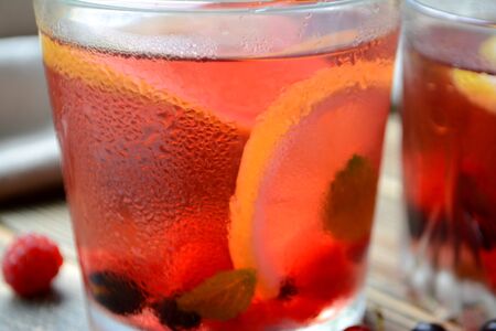 Cold berry lemonade in glasses Summer refreshing drink Close upの写真素材
