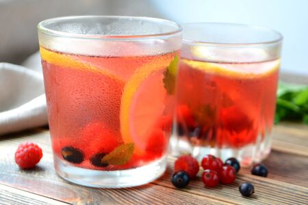 Cold berry lemonade in glasses Summer refreshing drinkの写真素材