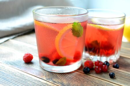 Cold berry lemonade in glasses Summer refreshing drinkの写真素材