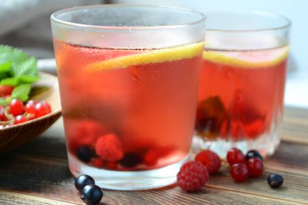 Cold berry lemonade in glasses Summer refreshing drinkの写真素材