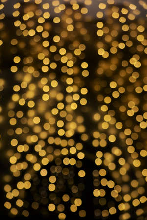 Golden christmas lights blur backgroundの写真素材