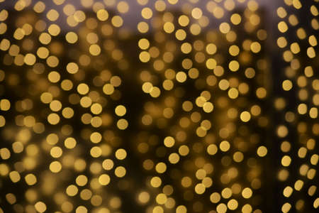 Golden christmas lights blur backgroundの写真素材