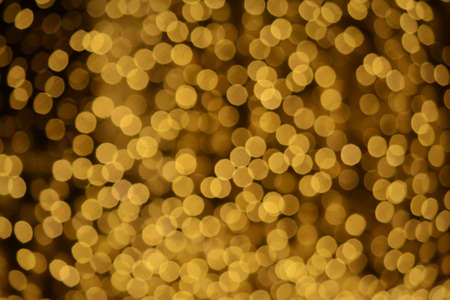 Golden christmas lights blur backgroundの写真素材