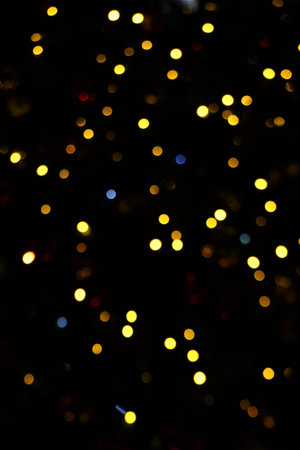 Golden christmas lights blur backgroundの写真素材