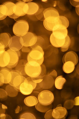 Golden christmas lights blur backgroundの写真素材