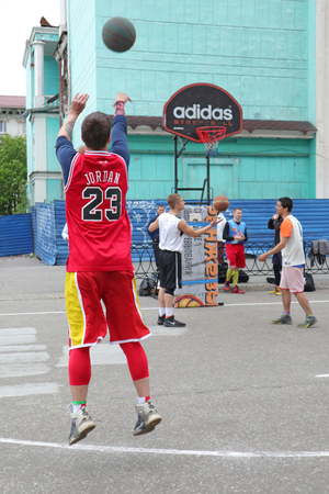 Russia, Murmansk-June 24, 2018: celebration of Russian youth Day, boys play street basketballのeditorial素材