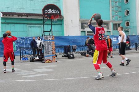 Russia, Murmansk-June 24, 2018: celebration of Russian youth Day, boys play street basketballのeditorial素材