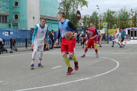 Russia, Murmansk-June 24, 2018: celebration of Russian youth Day, boys play street basketballのeditorial素材