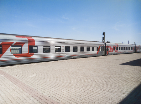 Russia, Kamenka - 11 August 2018 : the Train of the Russian Railways on the station platform Belinskayaのeditorial素材