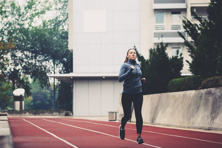 Young woman jogging on a cold day