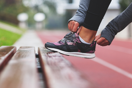 Close-up of running shoe, getting ready for joggingの写真素材