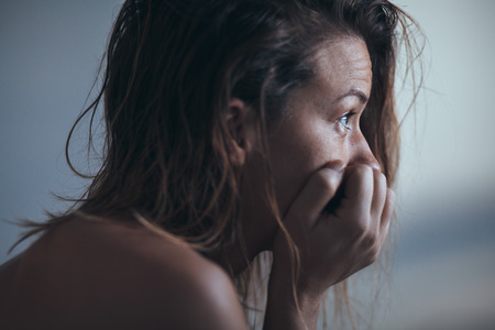 Woman sitting alone and depressedの写真素材