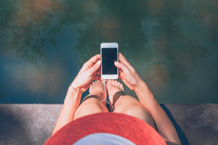 Young woman enjoying outdoors listening to the musicの写真素材