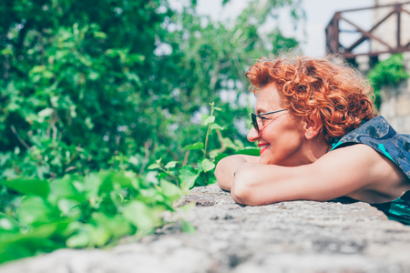 Beautiful retro older woman enjoying the viewの写真素材