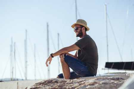 Man enjoying the view in the harborの写真素材
