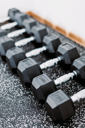 Weights in a row in a gymの写真素材