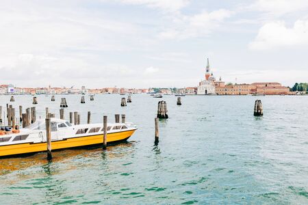 View of the canal from the pier in city of Venice, Italyの写真素材