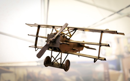 Metal steel sculpture of triplane in flying positionの写真素材