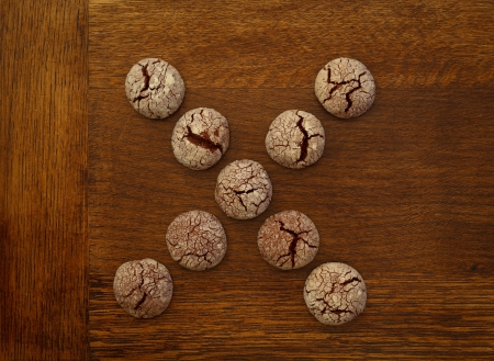 Chocolate cookies x sign on wooden boardの写真素材