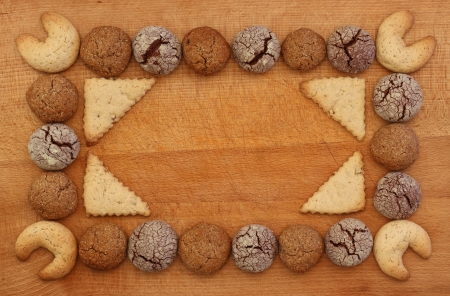 Chocolate, ginger and Hazelnut cookies frame on wooden board with stacking cookie ornament, copy spaceの写真素材