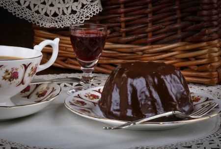 Mini Pound Cake - Chocolate hazelnut cake on old pictures tea cup, side plate on lace and red wine liquorの写真素材