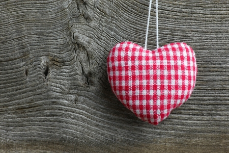 Christmas handmade decoration gingham fabric hearth over rustic Elm wood background - retro style design, copy spaceの写真素材