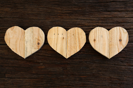 Love Valentines wooden hearts from recycled old palette on rough driftwood background, copy spaceの写真素材