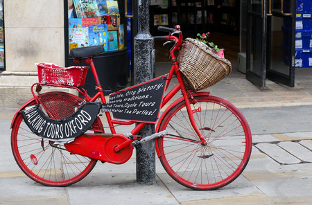 Walking tours poster for guided tours of Oxford university on red painted bicycleのeditorial素材