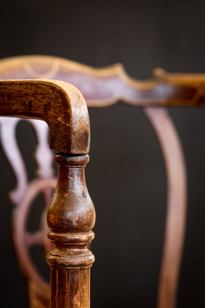 Old antique arm chair with inlays for wood repair and upholstery restorationの写真素材