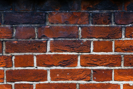 Background of old red vintage grunge brick wall textureの写真素材