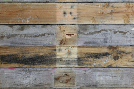 Pallet wood plank texture old grey brown with knots and nail holes wall natural grain dirt pattern backgroundの写真素材
