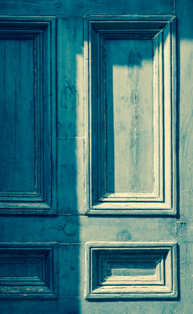 Weathered painted blue wooden door grunge textures and backgroundsの写真素材