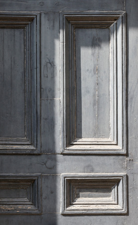 Weathered painted blue wooden door grunge textures and backgroundsの写真素材