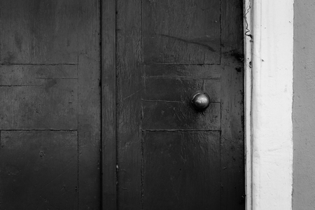 Weathered painted grey wooden door grunge textures and backgroundsの写真素材