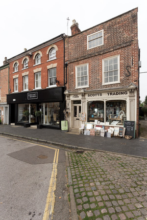 Winslow, Buckinghamshire, United Kingdom, October 25, 2016: Rocker + Robes and Scotts Trading on Market Square on grey chilly morningのeditorial素材