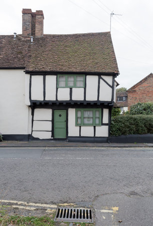 Winslow, Buckinghamshire, United Kingdom, October 25, 2016: Cottage on Horn street with green door...